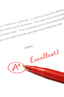 A scientific paper is sitting on a white background. The paper has "A+, Excellent!" written on it in red pen.