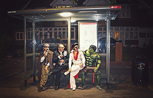 People in costumes, imitating various famous characters, represent the imitation game.