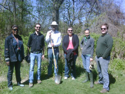 Scribendi.com staff stand with shovels outside of Paxton’s Bush in Chatham after planting 150 trees.