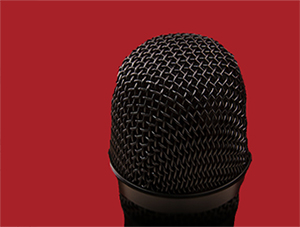 A microphone represents the stand-up comedian.
